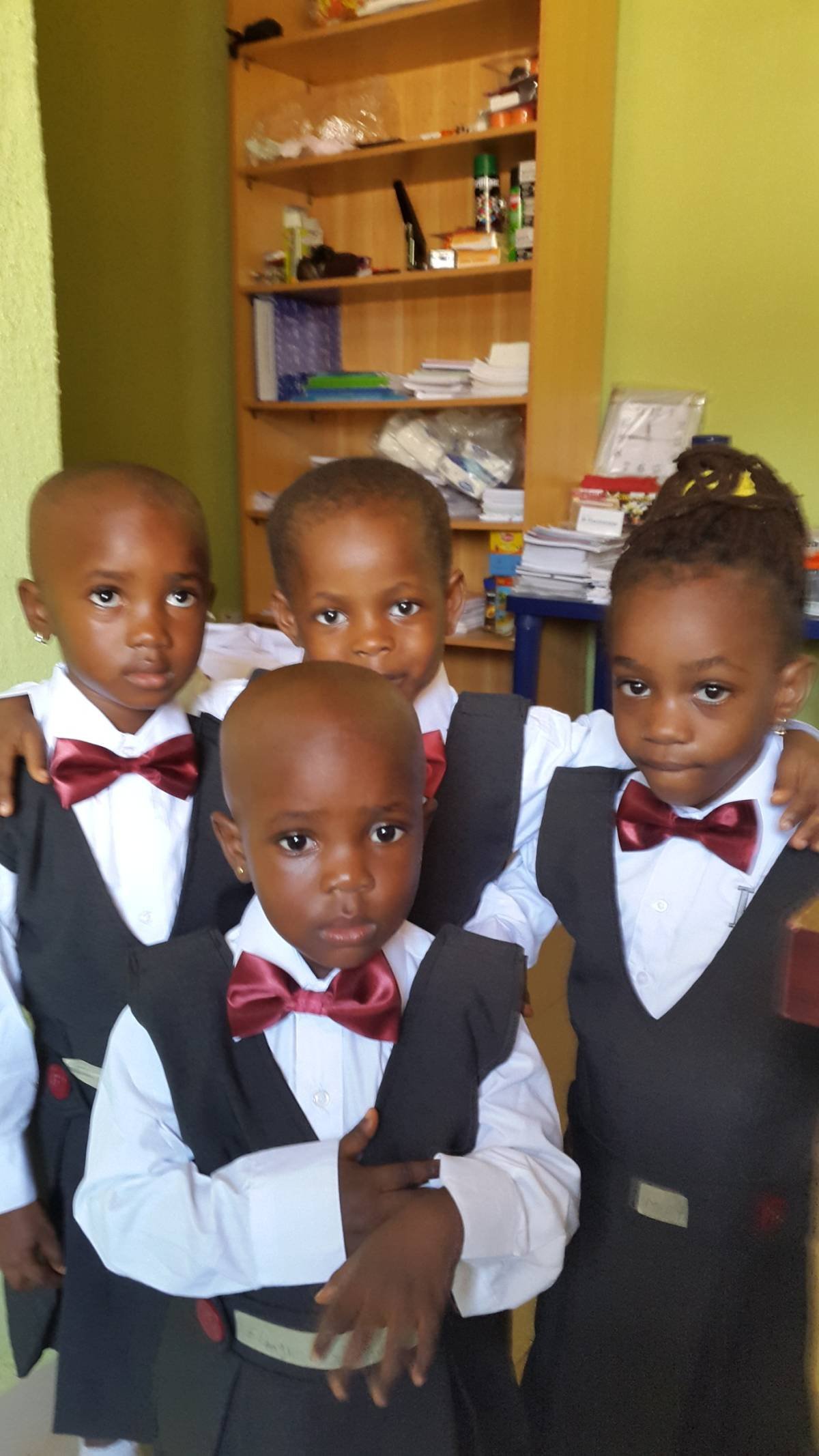 Smiling Lilydion pupils in official school uniform